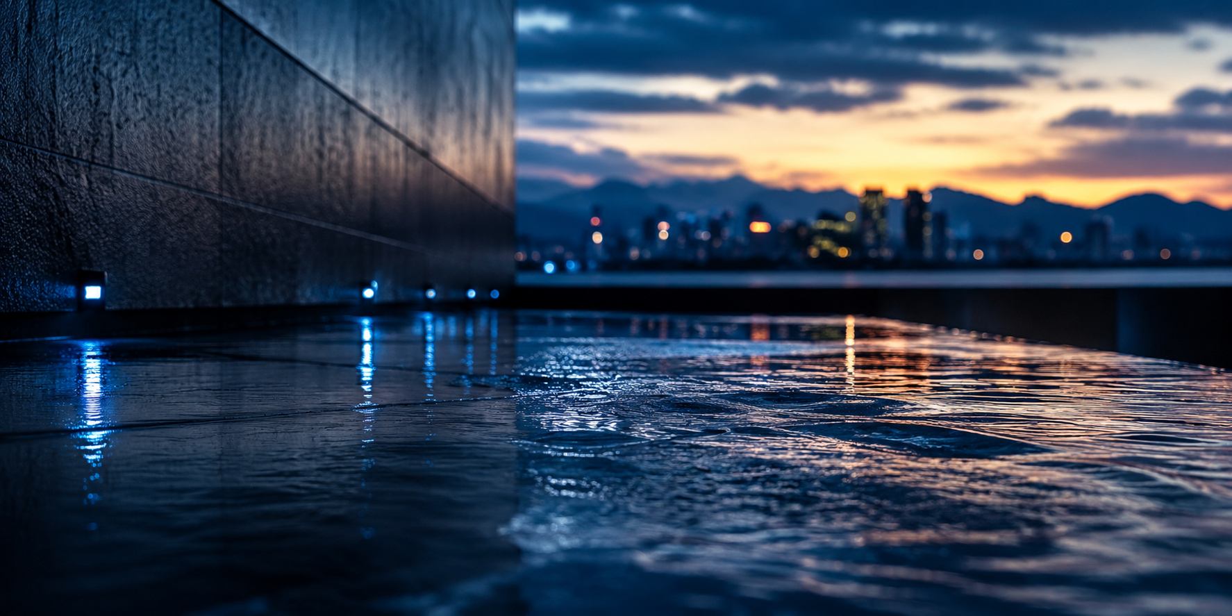 Wet reflective commercial surface with the Salt Lake City skyline at dusk